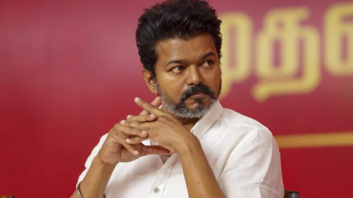 According to the complainant, the bouncers roughly pushed him away when he went to step onto the ramp where Vijay was. Kumar said he managed to grab onto a pipe, but he ended up with chest injuries from the fight. Authorities have charged the actor/politician and his bouncers with violations of sections 189(2), 296(B), and 115(I) from the Indian Penal Code. The fans are worried, as a case has been filed against Vijay.