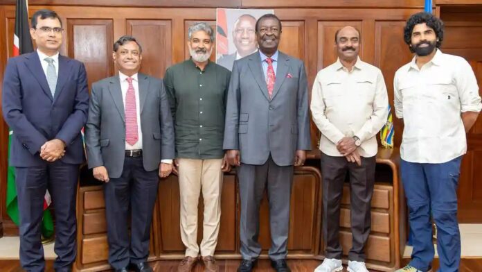 SSMB 29 Kenya shoot SSMB 29 Goes Global Rajamouli meets Kenya Foreign Affairs Secretary The Kenyan minister surprised everyone in a tweet by thanking people and revealing that SSMB 29 will hit 120 countries, making it the biggest release for an Indian film yet, even bigger than Shah Rukh Khan's Pathaan. Rajamouli is going all out to make the film get international recognition. The RRR director plans global promotions for SSMB 29.